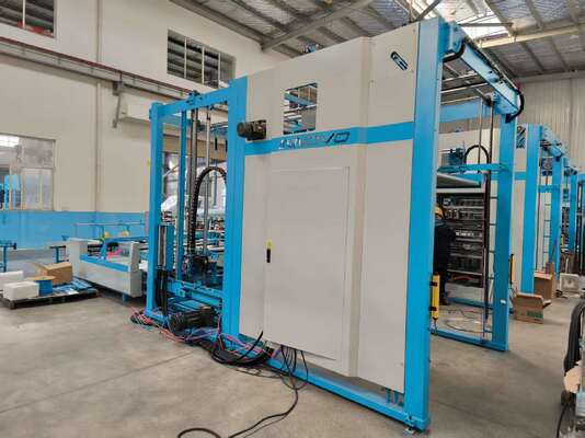 Machine d'empilage automatique à bascule intégrant une table à papier lente et des composants système pour le retournement et l'empilage de plastifieuses à cannelures dans la production d'emballages